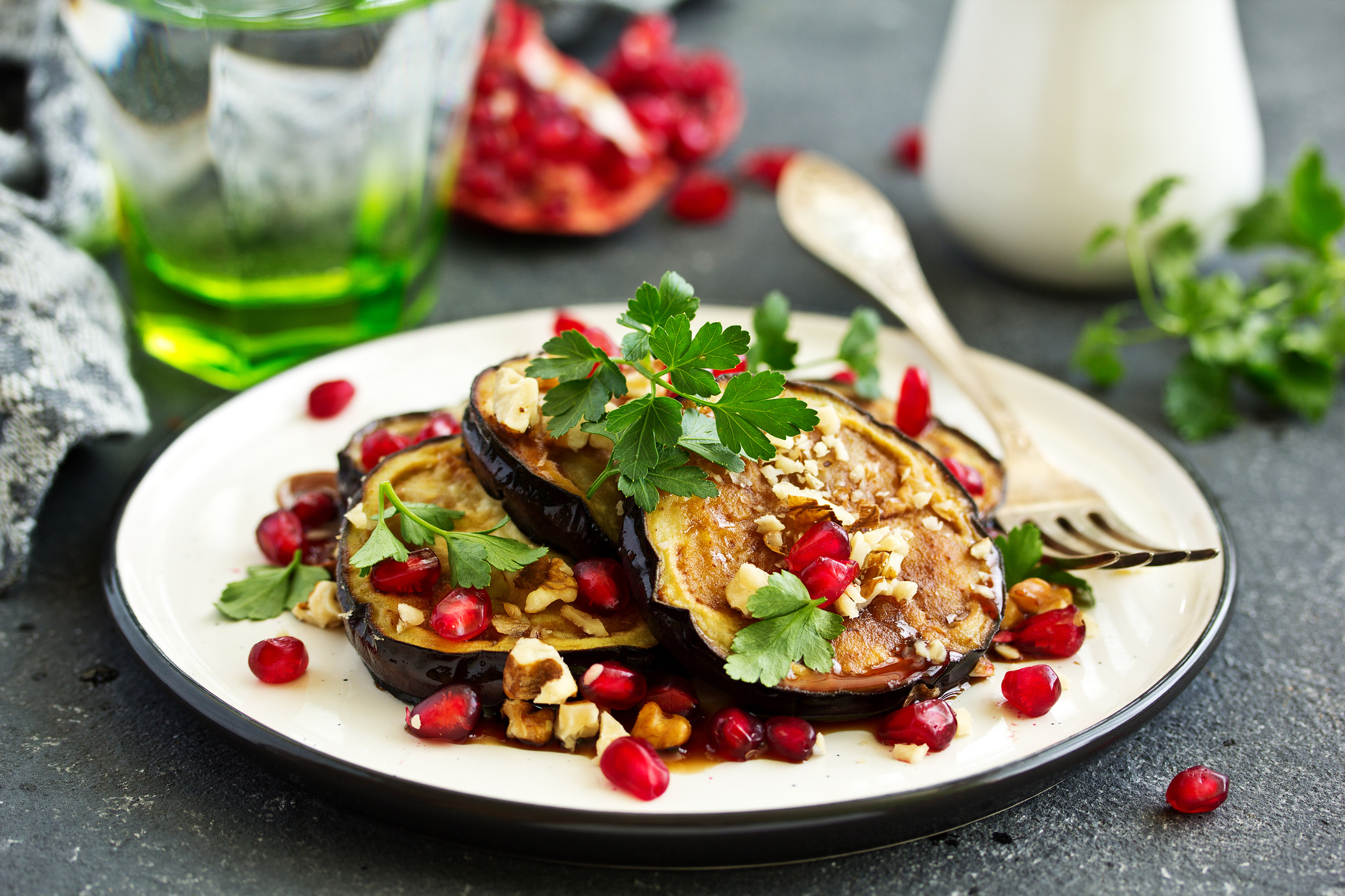Fried eggplants with pomegranate sauce and nuts.